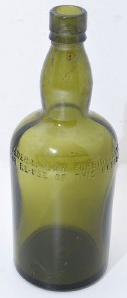 Bottle marked with text Federal Law Forbids Sale or Resuse...