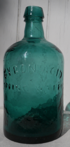 A rare deep blue green Byron Acid Springs bottle, mid 19th century.